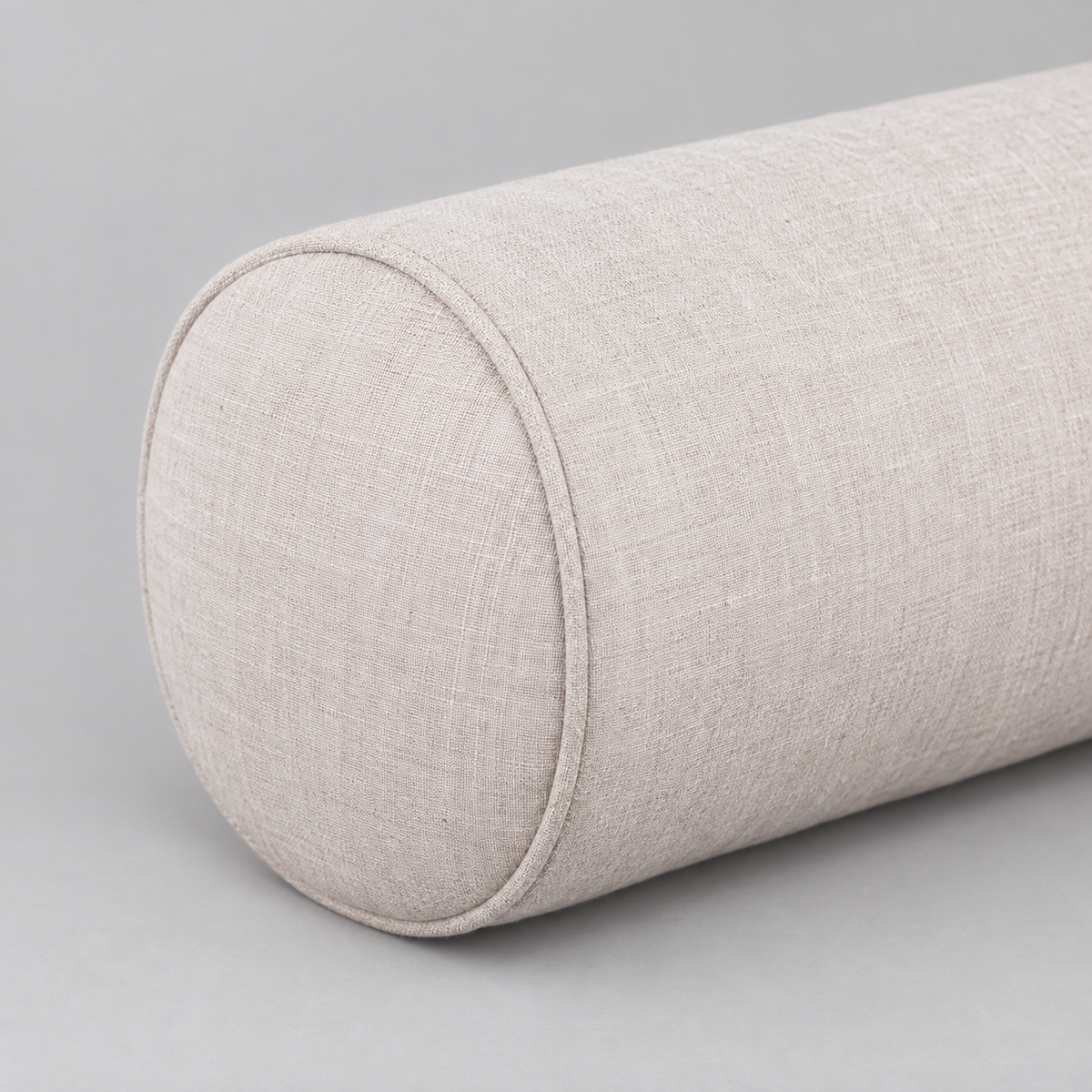 Close-up of the natural linen weave and circular bolster end seam