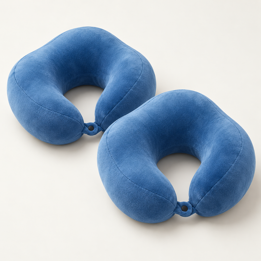Two blue U-shaped travel neck pillows with plush covers and front press-stud fastenings