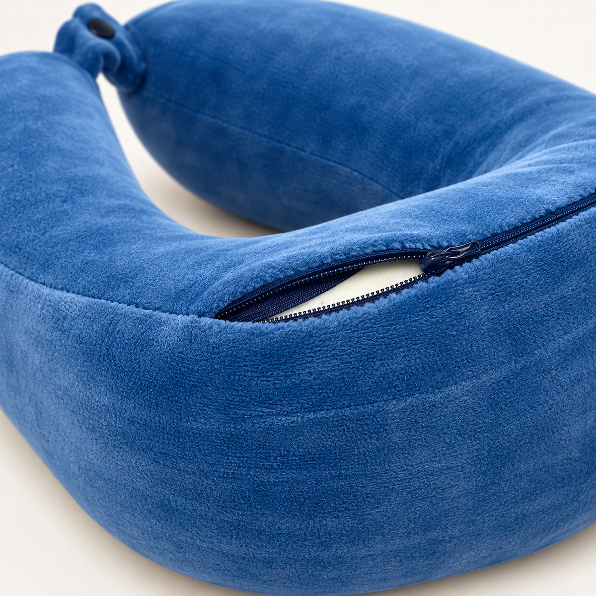 Close-up of the removable blue plush cover and dark zipper