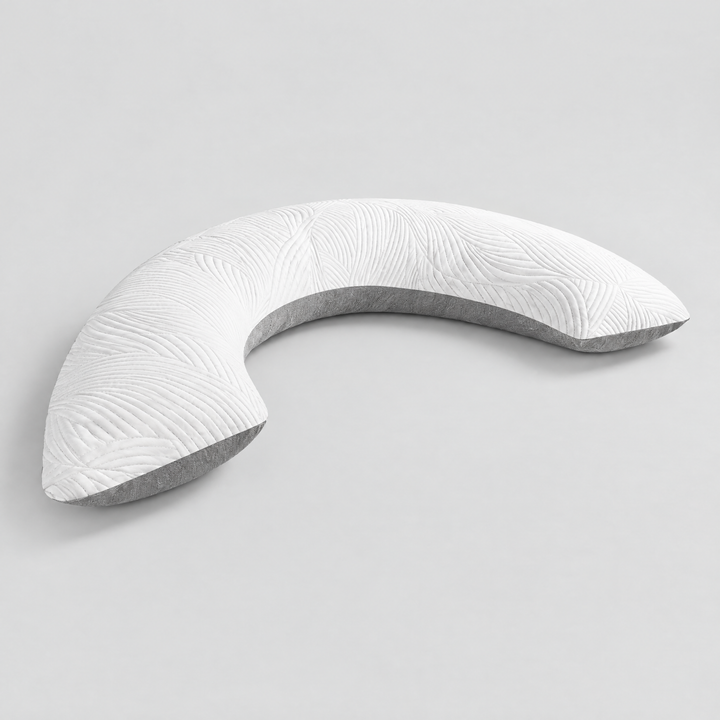 White and grey Somvane U-shaped body pillow on a plain background.